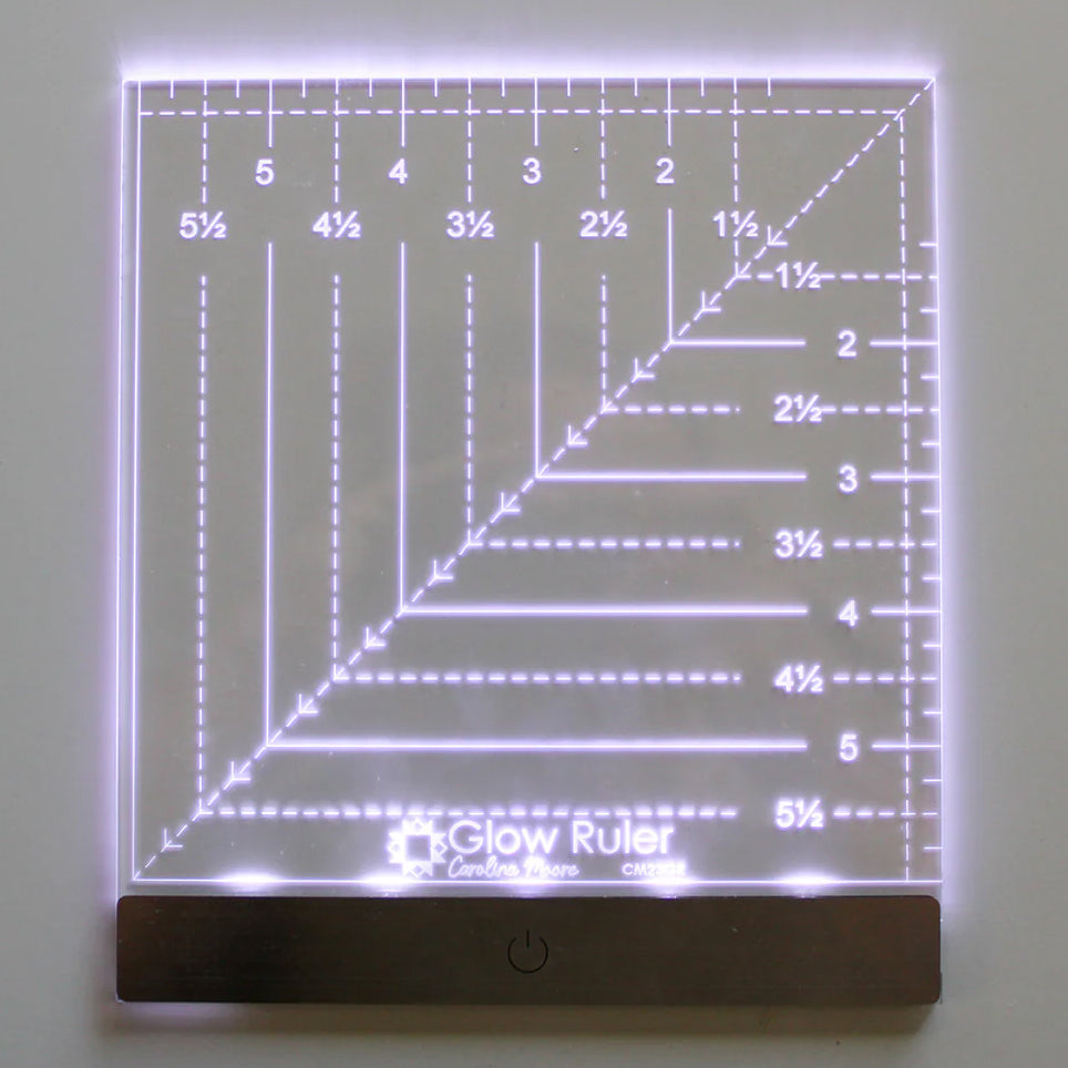 Carolina Moore 6-inch square Glow Ruler with built-in LED lights illuminating its white quilting measurement markings