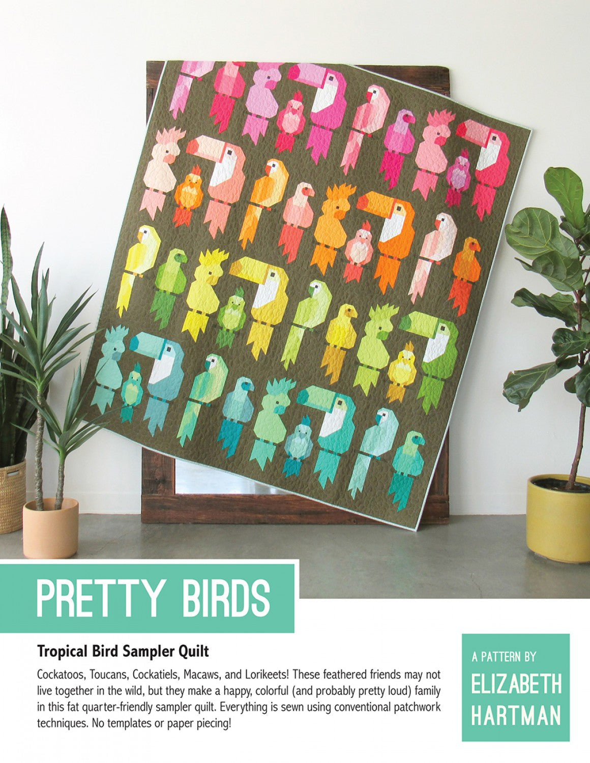 Pretty Birds quilt pattern cover by Elizabeth Hartman. Large 69 by 79 inch quilt leaning on a stand between houseplants shows 40 patchwork tropical birds -- Cockatoo, Toucan, Cockatiel, Macaw, and Lorikeet -- arranged in a rainbow gradient from pink and coral at the top through orange, yellow, green, and teal at the bottom, on a dark army green background. Each bird sits on a small patchwork perch.