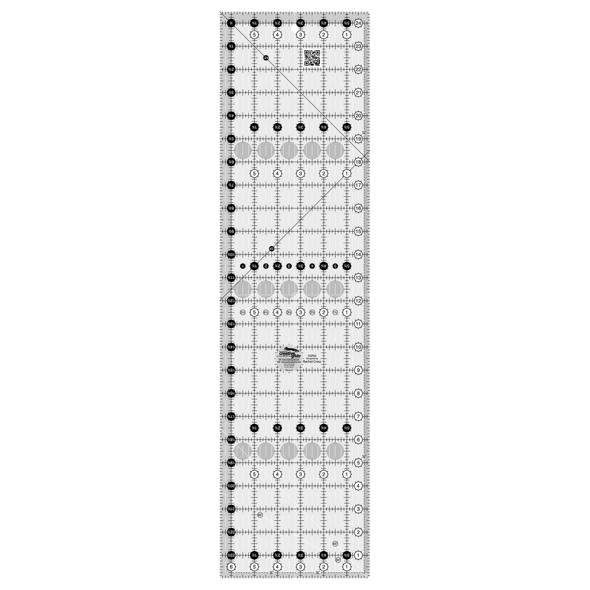 Creative Grids 6-1/2 x 24-1/2 inch rectangle quilt ruler CGR24 by Rachel Cross, grayscale render on white: 1 inch grid with 1/8 inch tick marks, black numbers 1 to 24 in white dots up one long edge and 1 to 6 along the bottom, white half-inch Turn-a-Round numbers in black dots on the other two edges, two black 45 degree lines crossing on the 1/4 inch dashed seam line, white 45 and 30/60 degree lines at one end, white centering lines, a QR code, and the Creative Grids non-slip logo circle.