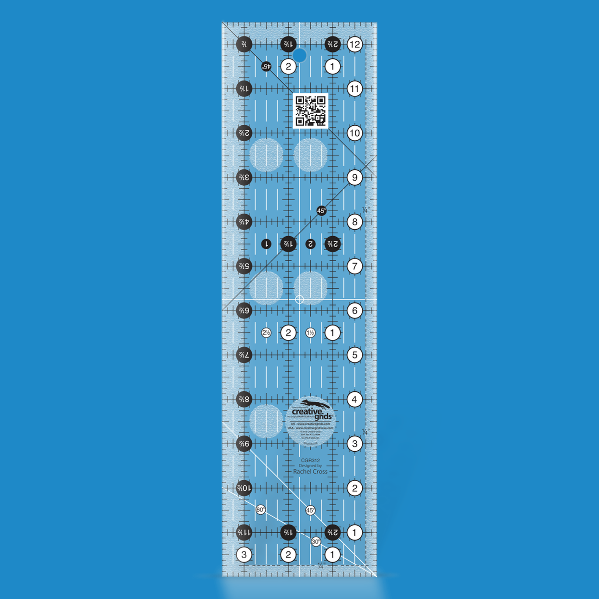 Creative Grids 3-1/2 x 12-1/2 inch rectangle quilt ruler CGR312 by Rachel Cross rendered in translucent blue acrylic with black and white grid markings, whole-inch numbers in white dots, half-inch Turn-a-Round numbers in black dots, crossed 45 degree lines, a 30/60 degree line, a 1/4 inch dashed seam line, and white centering lines.