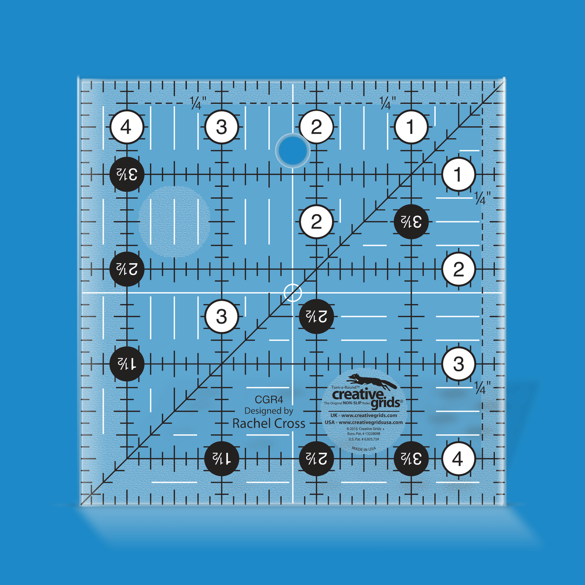 Creative Grids 4-1/2 inch square quilt ruler CGR4 by Rachel Cross rendered in translucent blue acrylic with black and white grid markings, whole-inch numbers in white dots, half-inch Turn-a-Round numbers in black dots, a 45 degree diagonal, a 1/4 inch dashed seam line, and white centering lines.