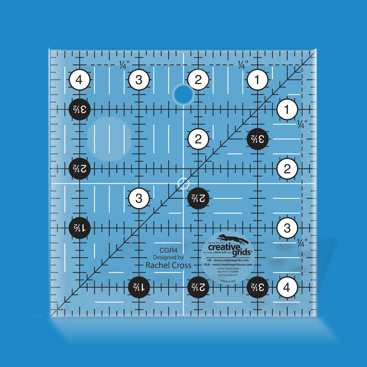 Creative Grids 4-1/2 inch square quilt ruler CGR4 by Rachel Cross rendered in translucent blue acrylic with black and white grid markings, whole-inch numbers in white dots, half-inch Turn-a-Round numbers in black dots, a 45 degree diagonal, a 1/4 inch dashed seam line, and white centering lines.