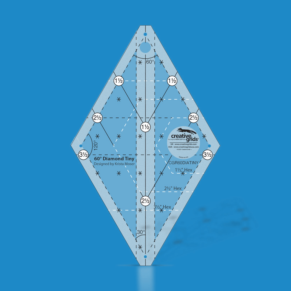 Creative Grids 60 Degree Tiny Diamond CGR60DIATINY by Krista Moser in translucent blue acrylic, diamond shape with circled labels 1 1/2 to 3 1/2 along the upper edges, solid angled lines, dashed horizontal lines, 60, 120, and 30 degree angle labels, Hex outlines, asterisk marks, and the Designed by Krista Moser credit.