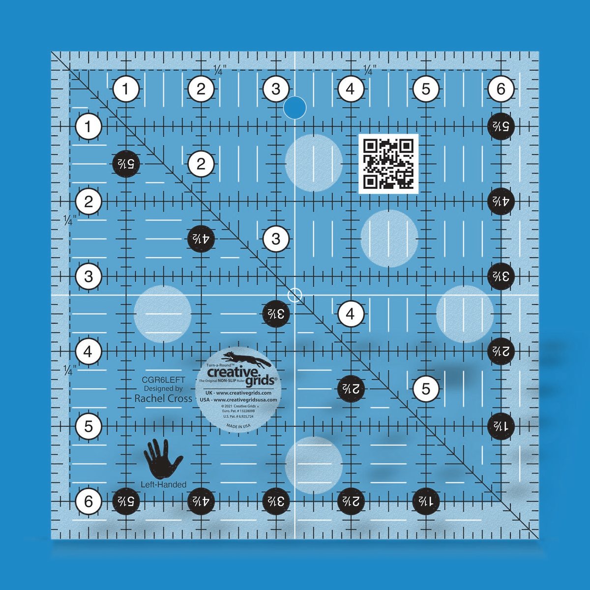 Creative Grids left handed 6-1/2 inch square quilt ruler CGR6LEFT by Rachel Cross rendered in translucent blue acrylic with black and white grid markings mirrored for left-handed cutting, whole-inch numbers in white dots on the top and left, half-inch Turn-a-Round numbers in black dots, a 45 degree diagonal, a 1/4 inch dashed seam line, white centering lines, and a left-hand icon.