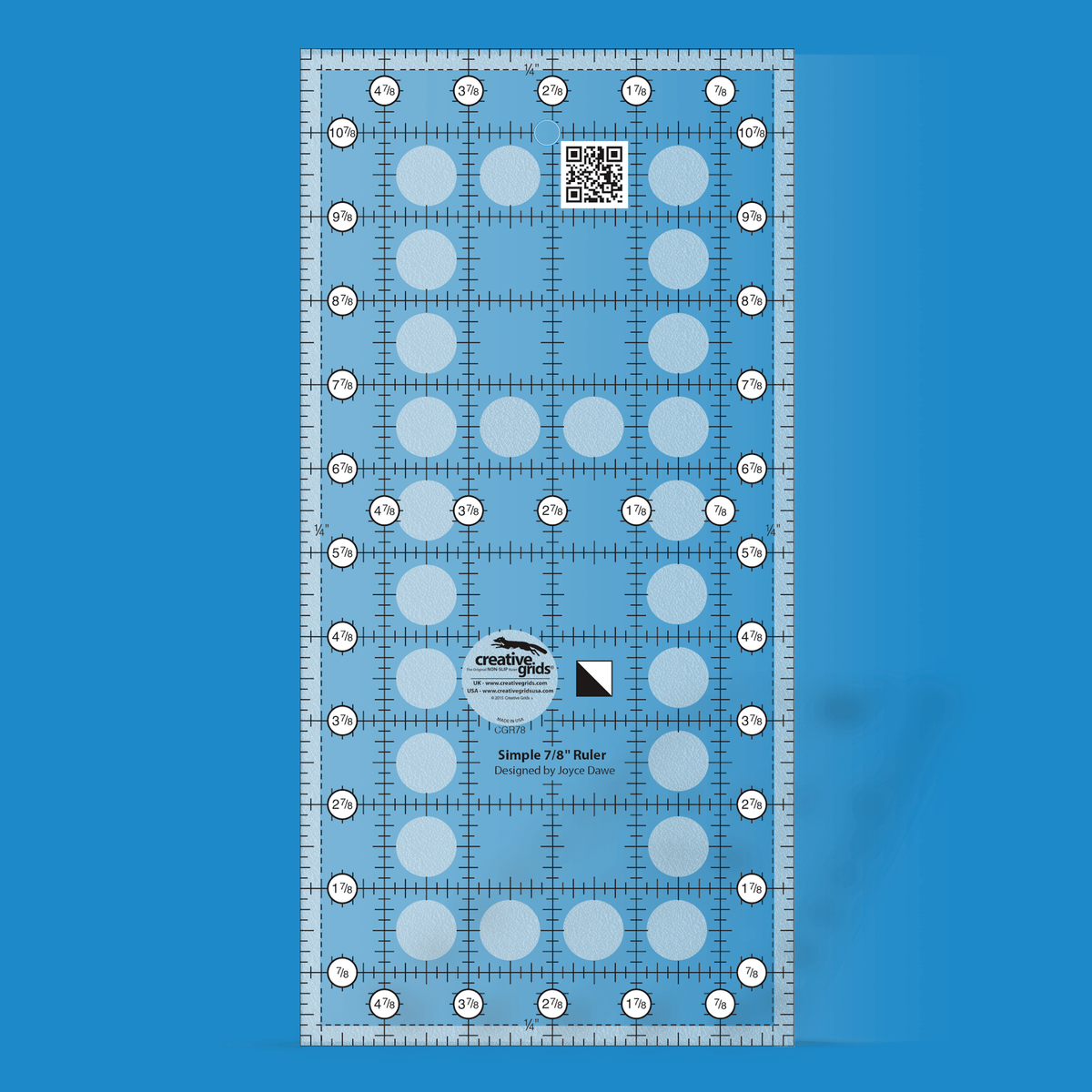 Creative Grids Simple 7/8 Triangle Maker CGR78 by Joyce Dawe in translucent blue acrylic with black grid lines and tick marks, circled labels from 7/8 to 4 7/8 across and 7/8 to 10 7/8 up both sides, dashed 1/4 inch lines inside the edges, QR code, and a half-square triangle block icon beside the logo circle.