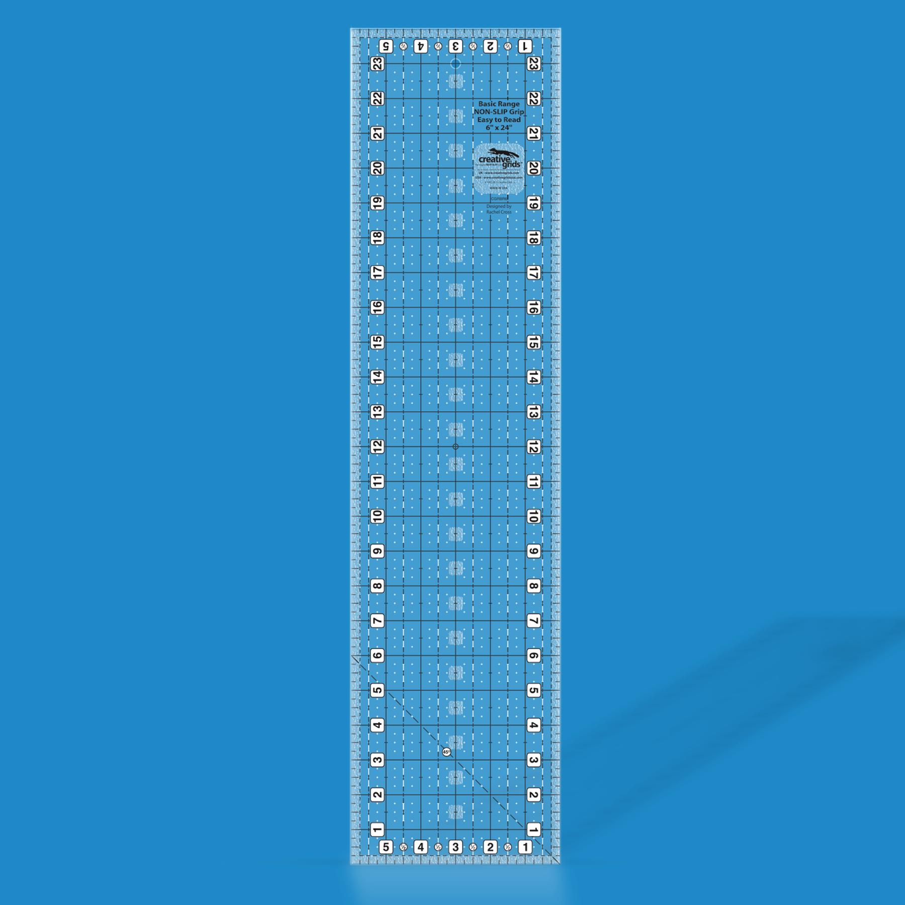 Creative Grids Basic Range 6-inch x 24-inch rectangle quilt ruler CGRBR6 rendered in translucent blue acrylic with black and white grid markings, numbered edges, and a 45-degree diagonal line.