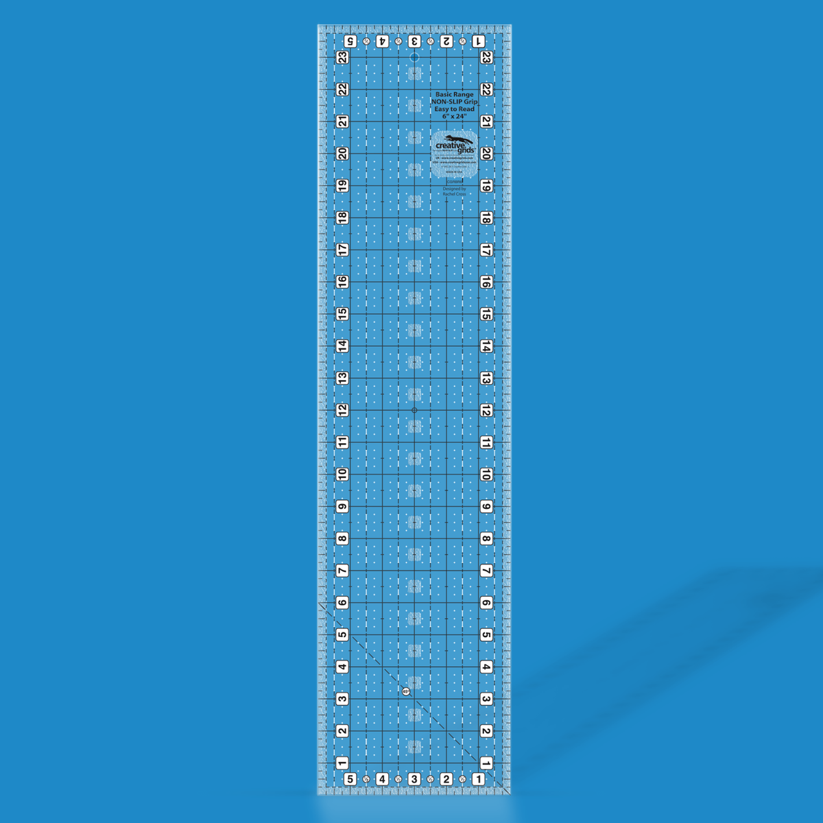 Creative Grids Basic Range 6-inch x 24-inch rectangle quilt ruler CGRBR6 rendered in translucent blue acrylic with black and white grid markings, numbered edges, and a 45-degree diagonal line.
