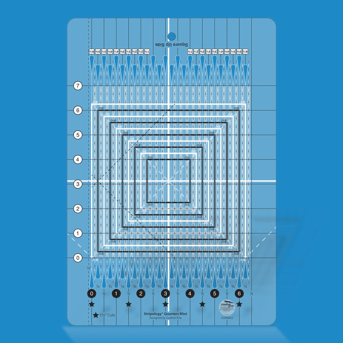 Stripology Quarters Mini quilt ruler by Gudrun Erla for Creative Grids shown in translucent blue acrylic, highlighting the quarter-inch cutting slits, flying geese trim lines, and non-slip grip surface of the 8 1/2 x 12 1/2 inch ruler.