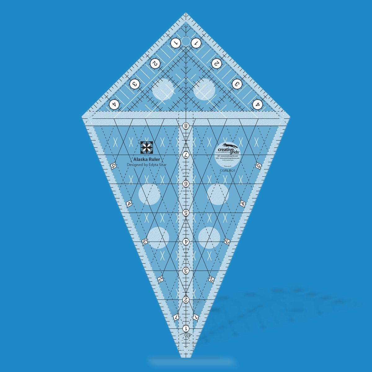 Creative Grids Alaska Ruler CGRLBQ1 by Edyta Sitar in translucent blue acrylic, kite shape with a center line numbered 1 to 8, a gridded corner section numbered 1 to 4, crossing solid and dashed diagonal lines with diamond labels 1 to 5, and a star block icon above the Designed by Edyta Sitar credit.