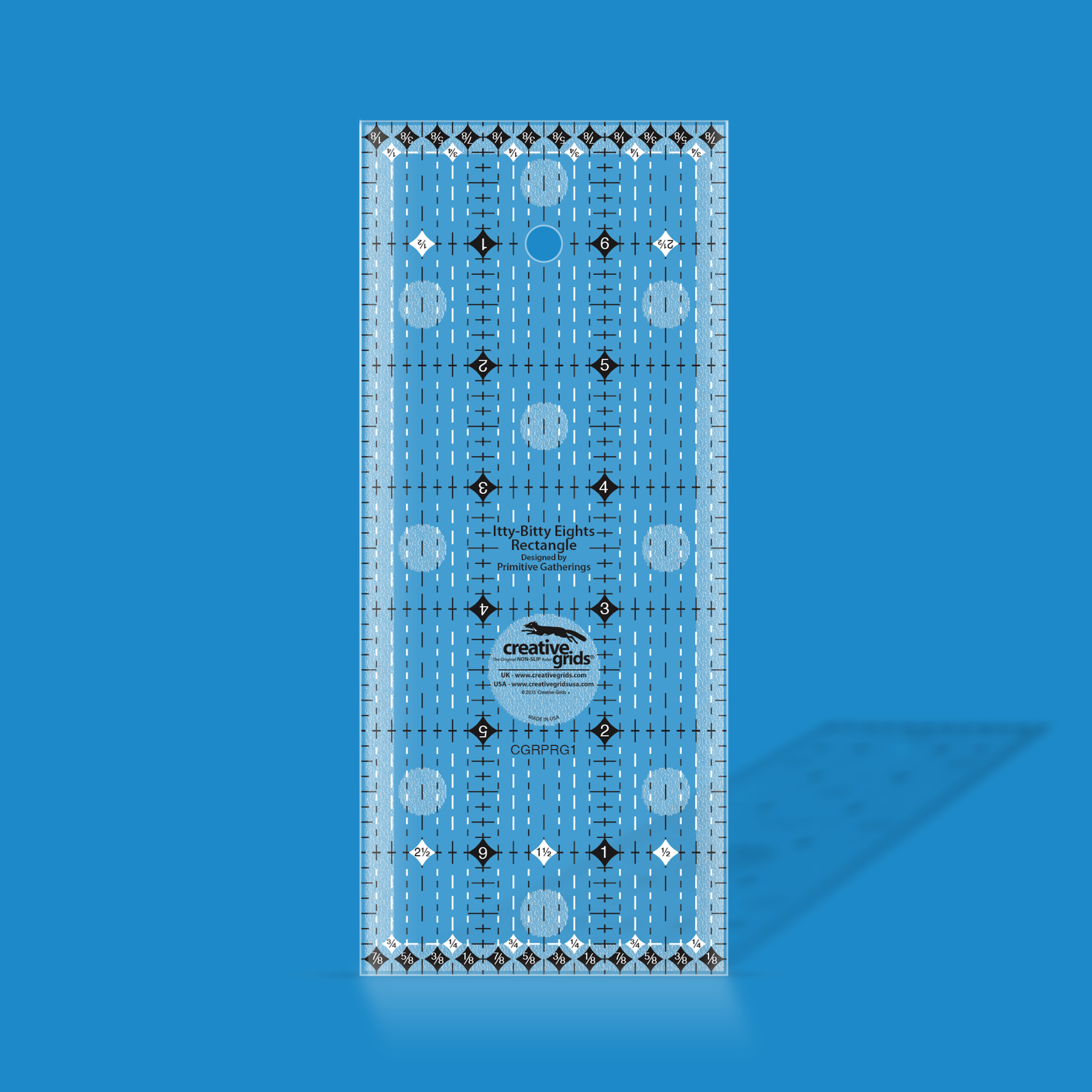 Creative Grids Itty-Bitty Eights 3 x 7 inch rectangle quilt ruler by Lisa Bongean shown in translucent blue acrylic, with black and white dashed eighth inch grid markings, diamond symbols, and the Creative Grids non-slip logo circle.