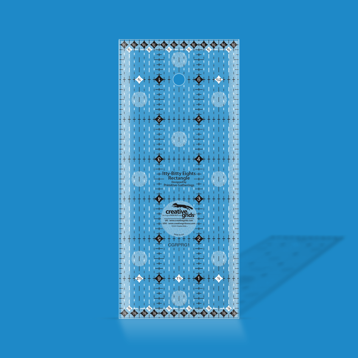 Creative Grids Itty-Bitty Eights 3 x 7 inch rectangle quilt ruler by Lisa Bongean shown in translucent blue acrylic, with black and white dashed eighth inch grid markings, diamond symbols, and the Creative Grids non-slip logo circle.