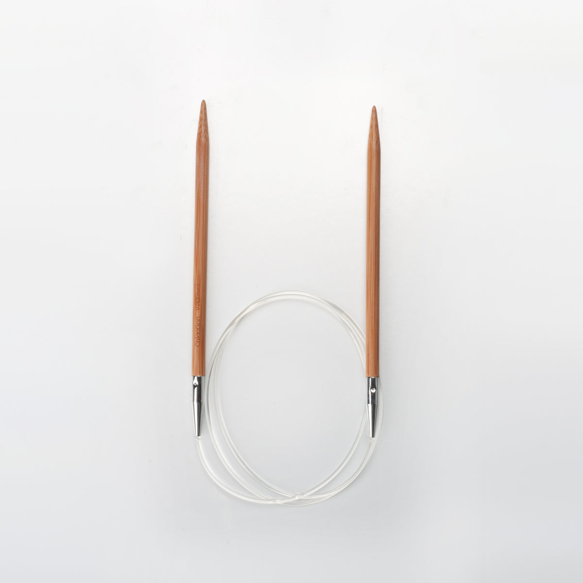 ChiaoGoo 32-inch bamboo circular knitting needle on a light gray background. Two brown bamboo tips stand upright with the points up, and a clear cable joins their metal ends in a loop below.