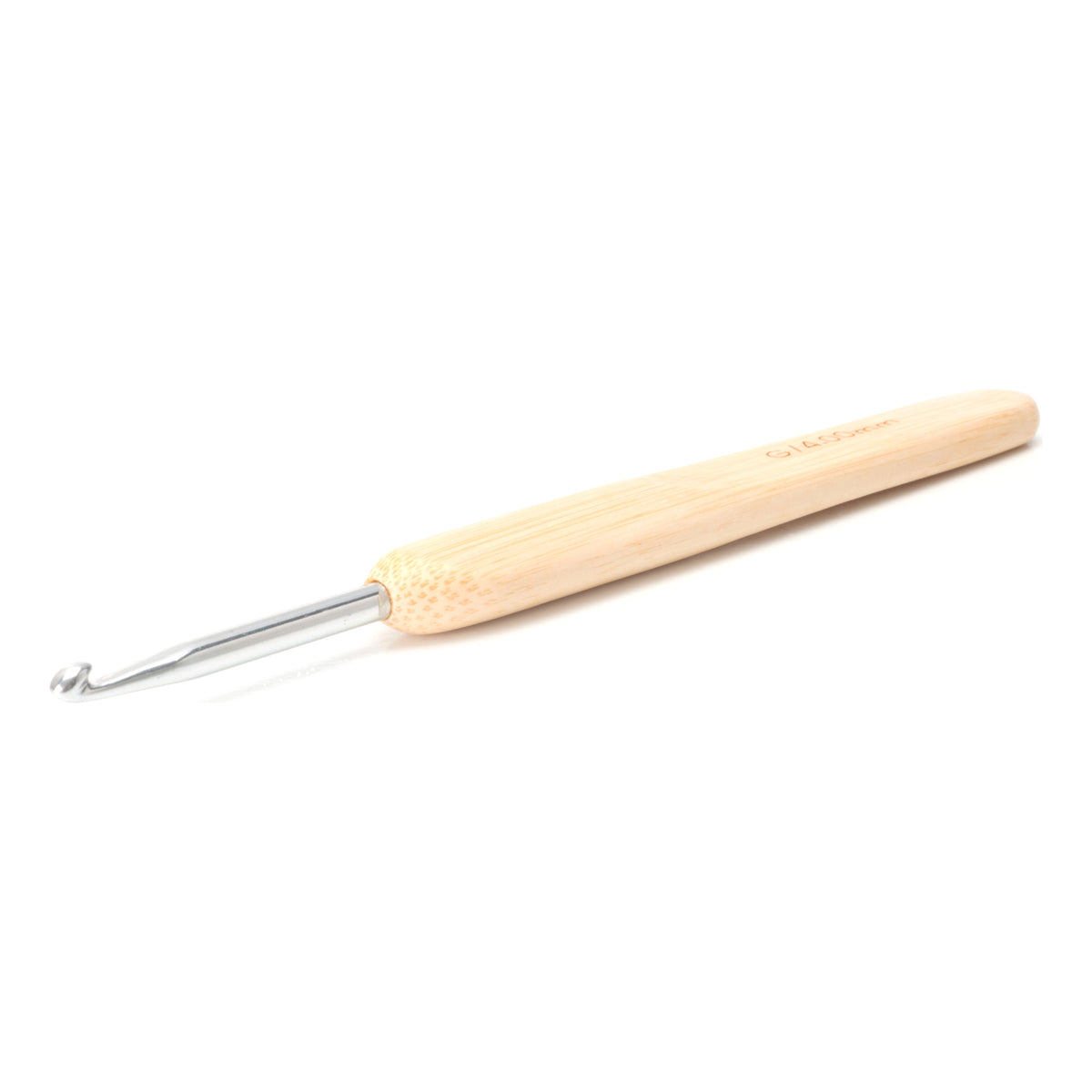 ChiaoGoo crochet hook with a metal head and a bamboo handle, lying at an angle on a white background. The silver metal shaft ends in a hook at the lower left, and the pale bamboo handle widens toward the upper right.