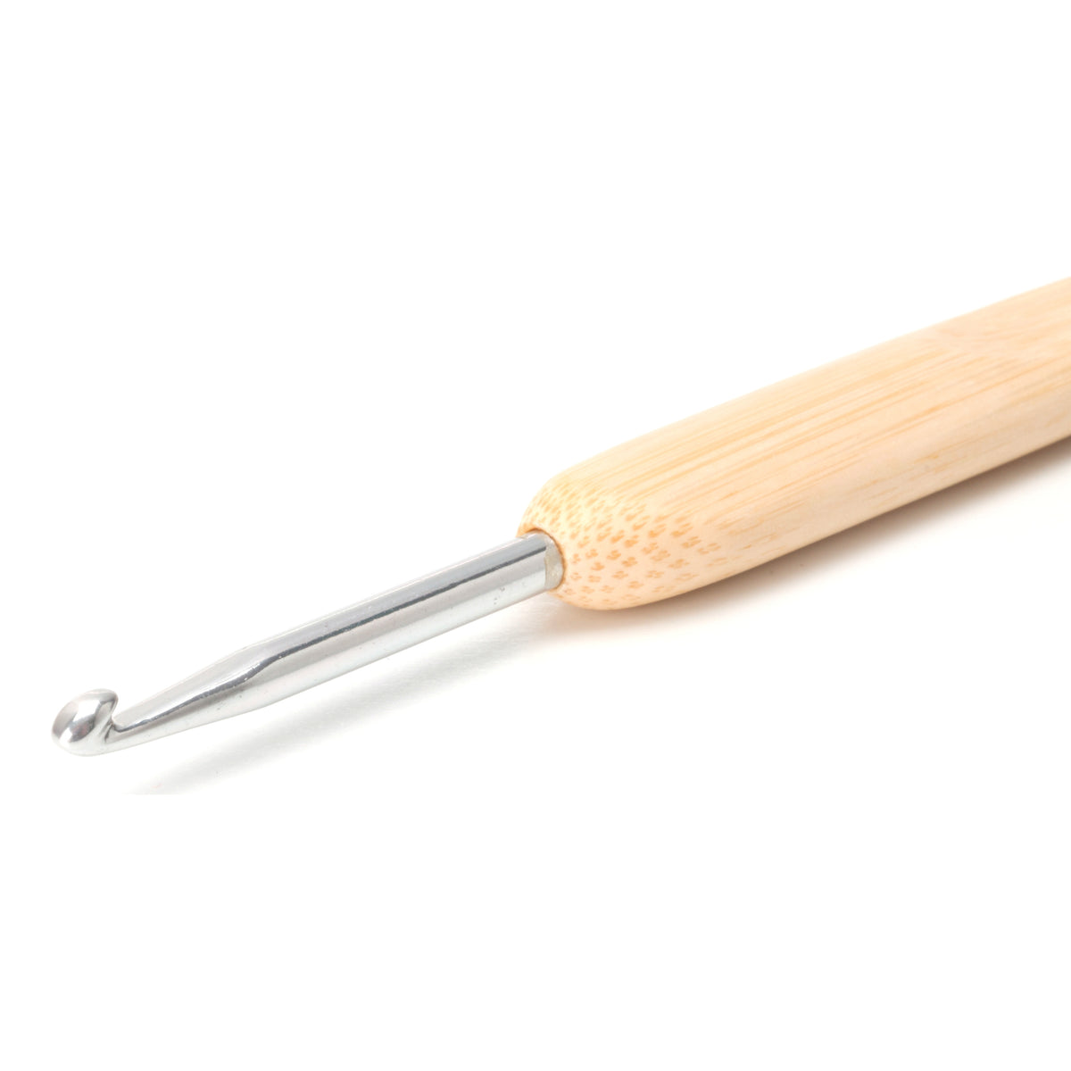 Close-up of the metal head of a ChiaoGoo crochet hook on a white background. The silver shaft ends in a rounded hook and enters the end of a pale bamboo handle.