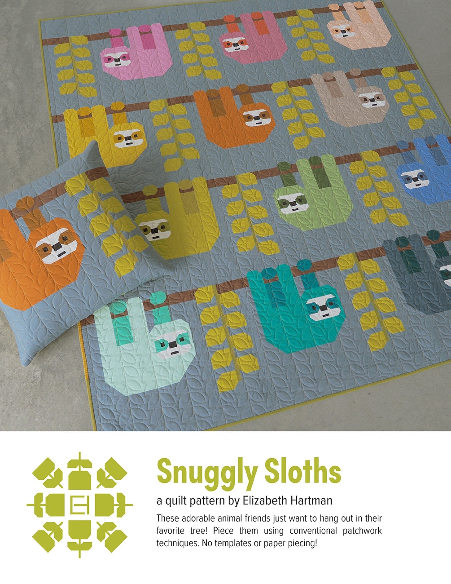 Snuggly Sloths quilt pattern cover by Elizabeth Hartman. Large 68 by 74 inch quilt and pillow displayed on a floor show 12 patchwork sloths in pink, orange, tan, yellow, green, teal, blue, and other solid colors hanging upside down from horizontal brown branch strips on a cool gray background, surrounded by yellow-green leaf and vine blocks.