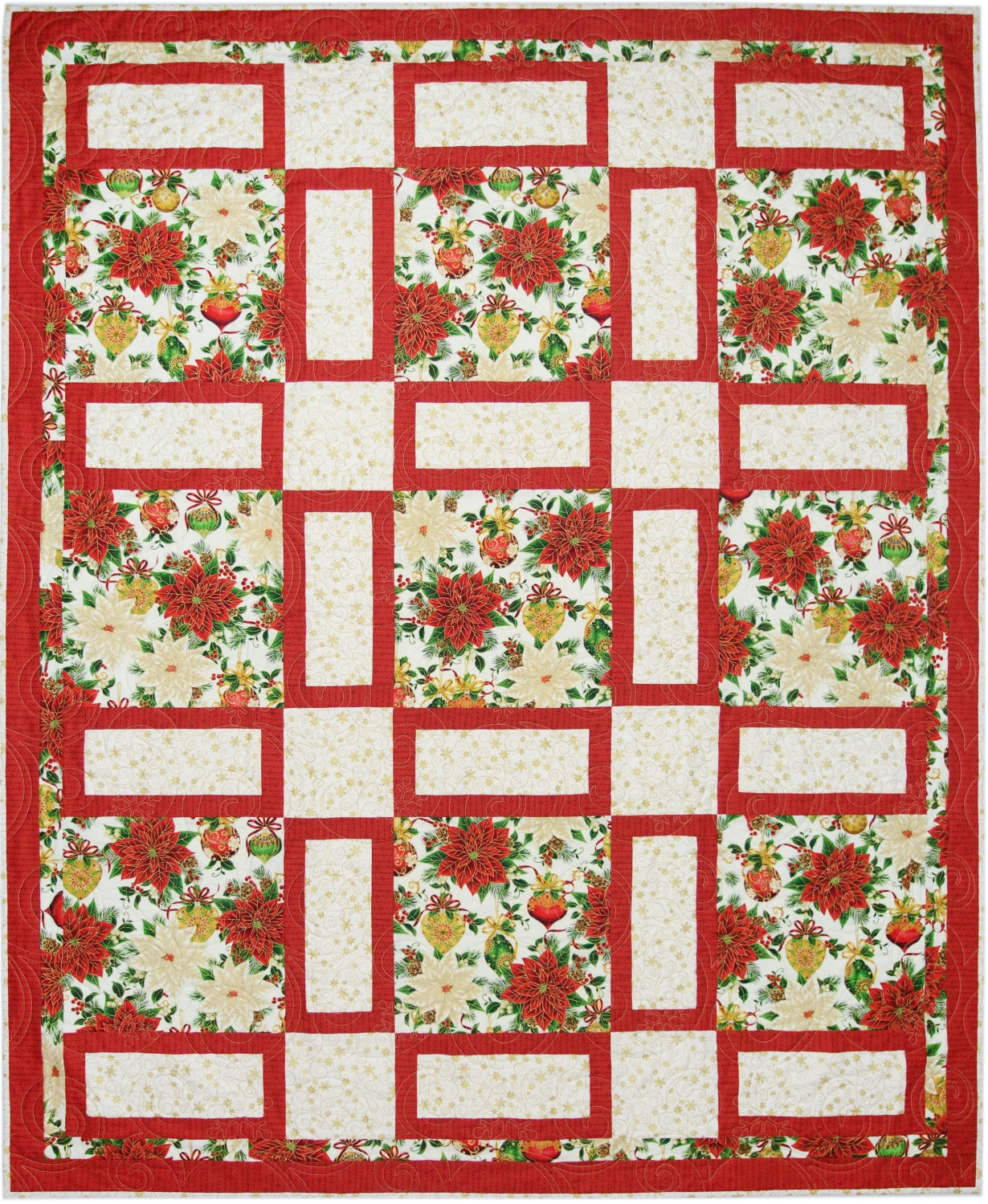 Fireside quilt from Make It Christmas with 3-Yard Quilts by Fabric Cafe. Red sashing forms a grid around cream rectangles and squares of a red poinsettia and ornament print, finished with a red border.
