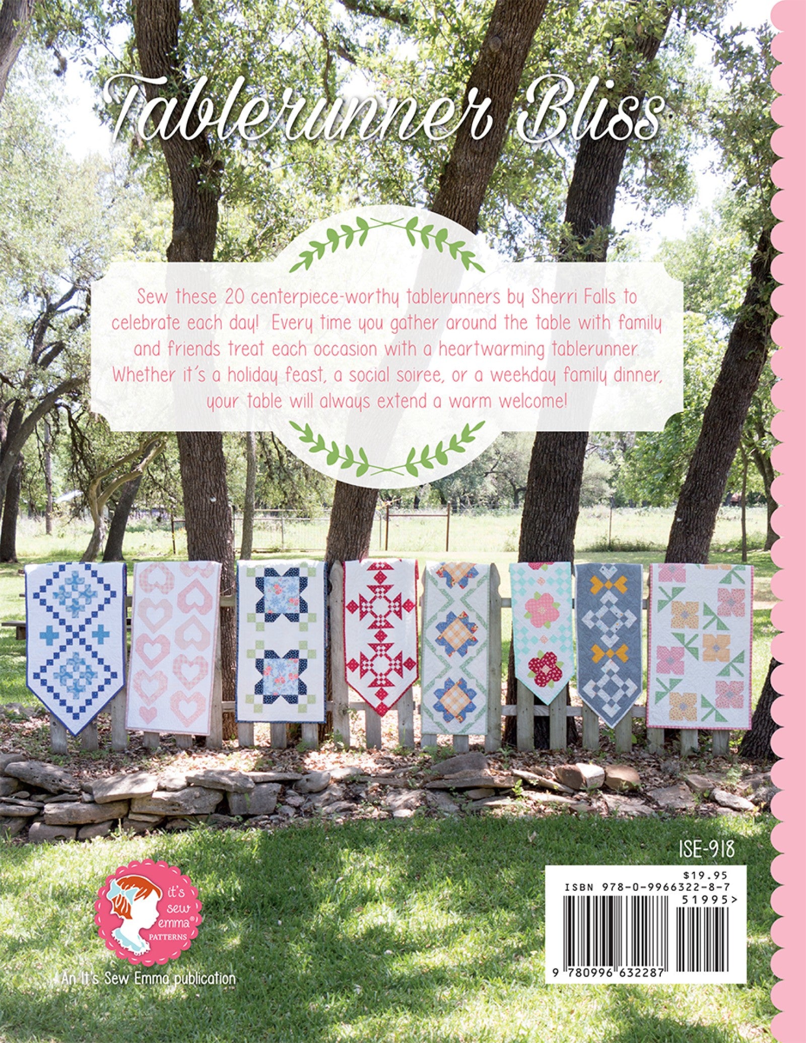 Back cover of Tablerunner Bliss from It's Sew Emma, twenty table runners displayed on a fence with the book blurb and the It's Sew Emma Patterns logo.