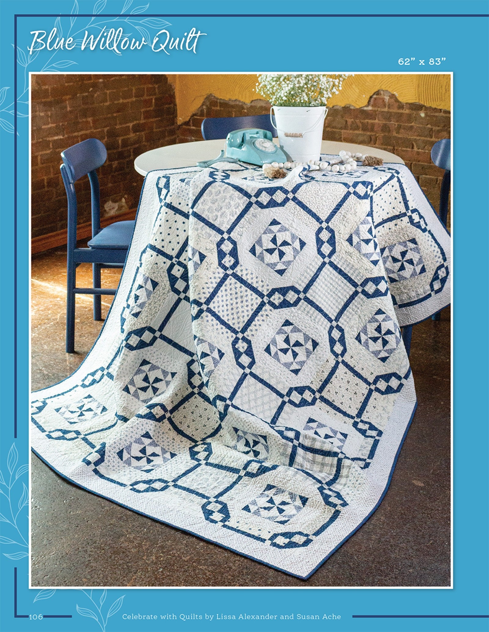 Blue Willow Quilt from Celebrate With Quilts, navy and white sampler blocks on a table.