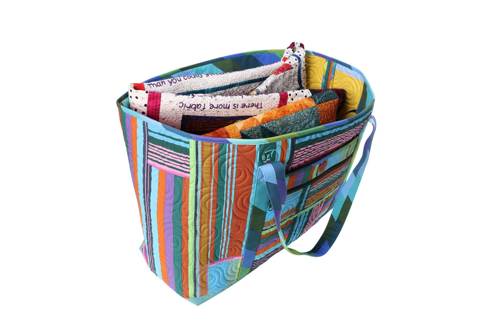 A Two Big Tote shown open from above, filled with rolled fabric and supplies, showing the roomy interior and organizing pockets.