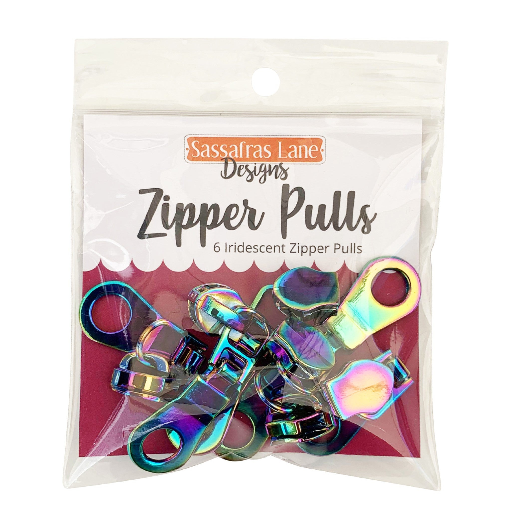 Six iridescent rainbow donut-hole zipper pulls from Sassafras Lane Designs in retail packaging labeled Zipper Pulls. Pack of 6, fits #5 nylon coil zipper tape, oil-slick metallic finish.