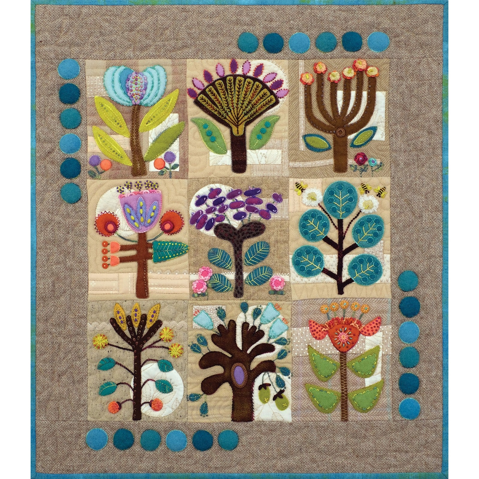The finished Rooted quilt by Sue Spargo of Folk Art Quilts. Nine folk art trees and flowers in layered wool and cotton, with embroidery and a teal wool coin border, on soft neutral patchwork blocks.