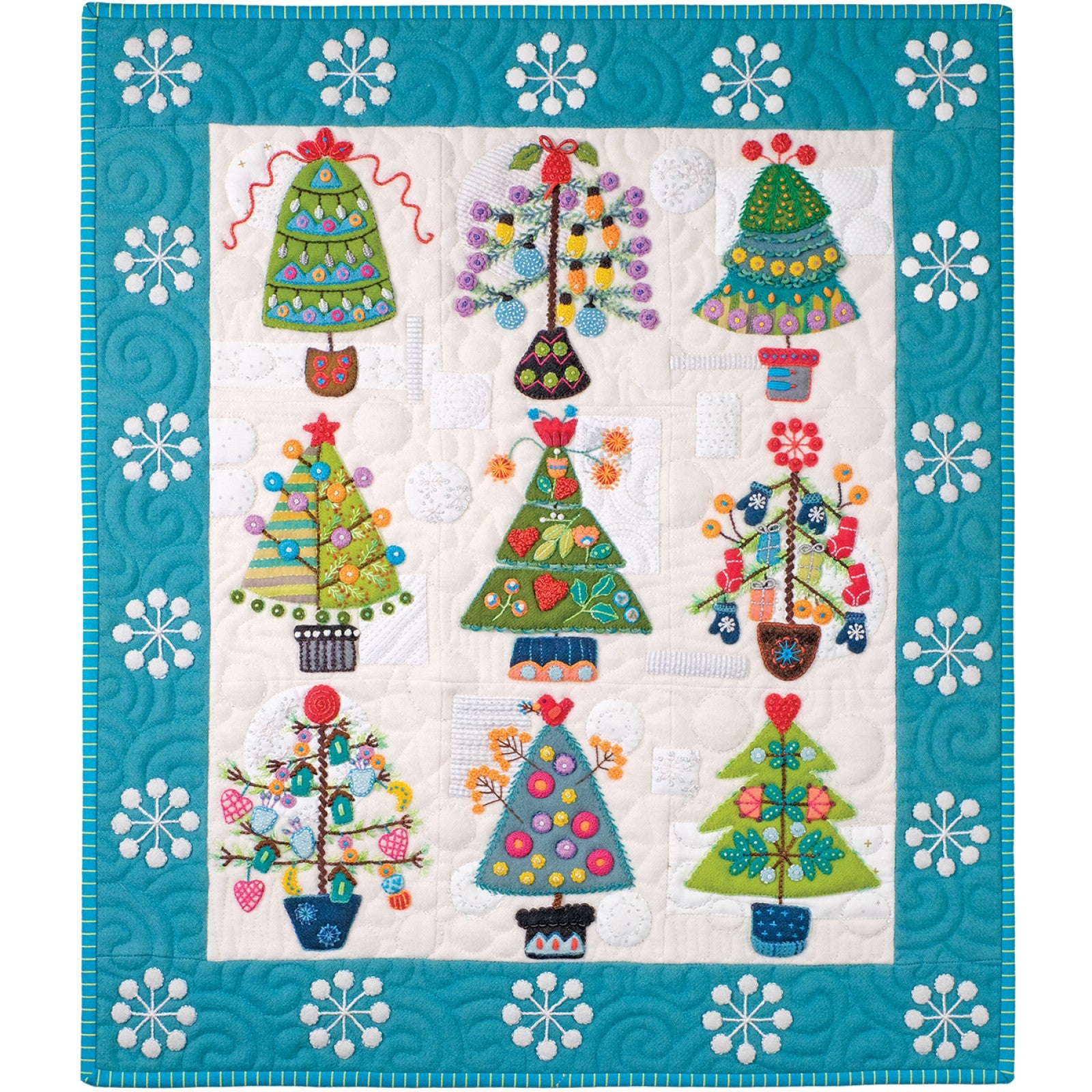 The finished Tinsel quilt by Sue Spargo of Folk Art Quilts. Folk art Christmas trees in layered wool and cotton, trimmed with embroidered lights and ornaments, on a white-on-white background framed by a blue border of white snowflakes.