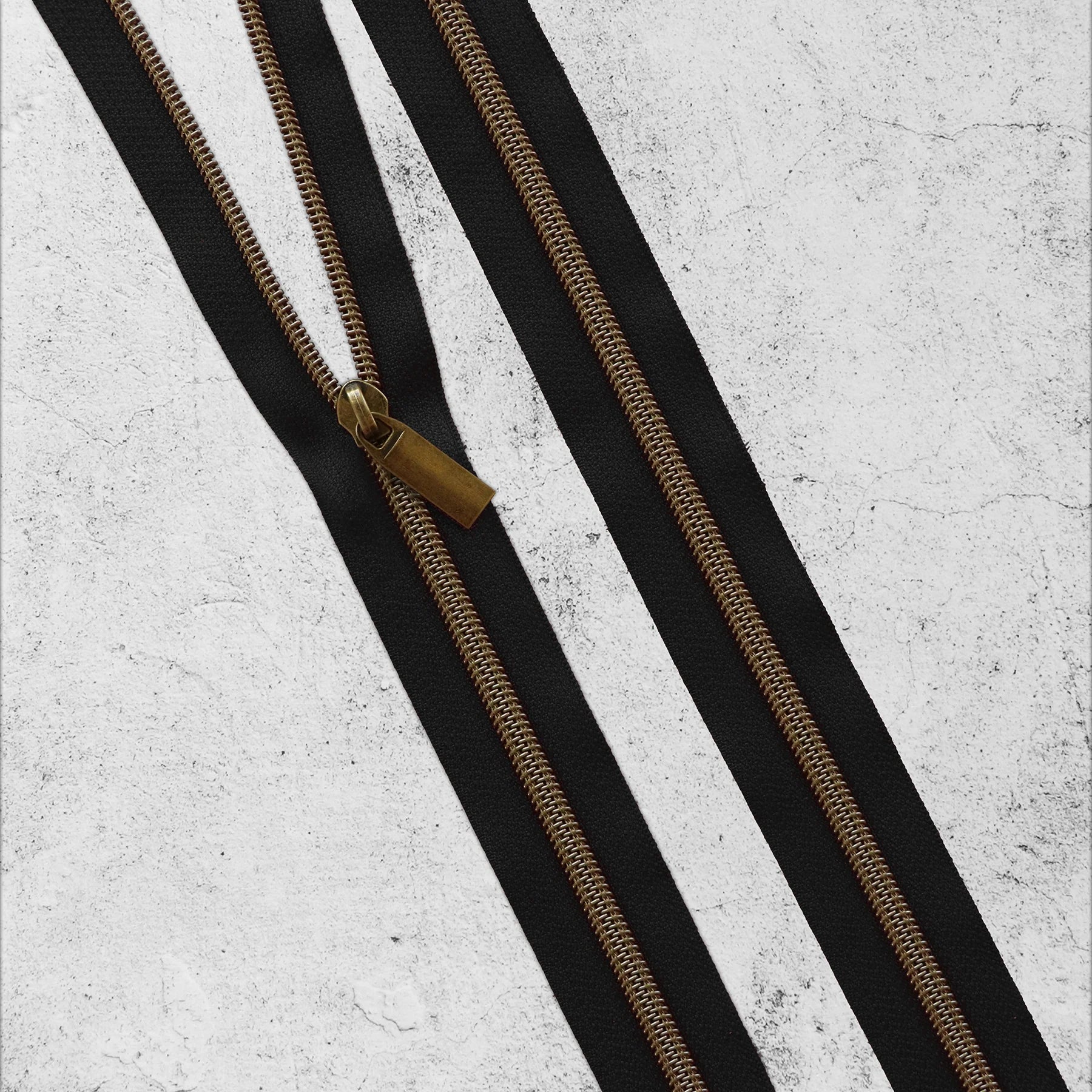 Black #5 Nylon Antique Brass Coil Zippers: 3 Yards with 9 Pulls from Sallie Tomato