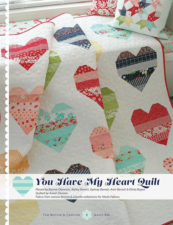 You Have My Heart Quilt from The Bonnie & Camille Quilt Bee, scrappy heart blocks in soft prints on a white background.