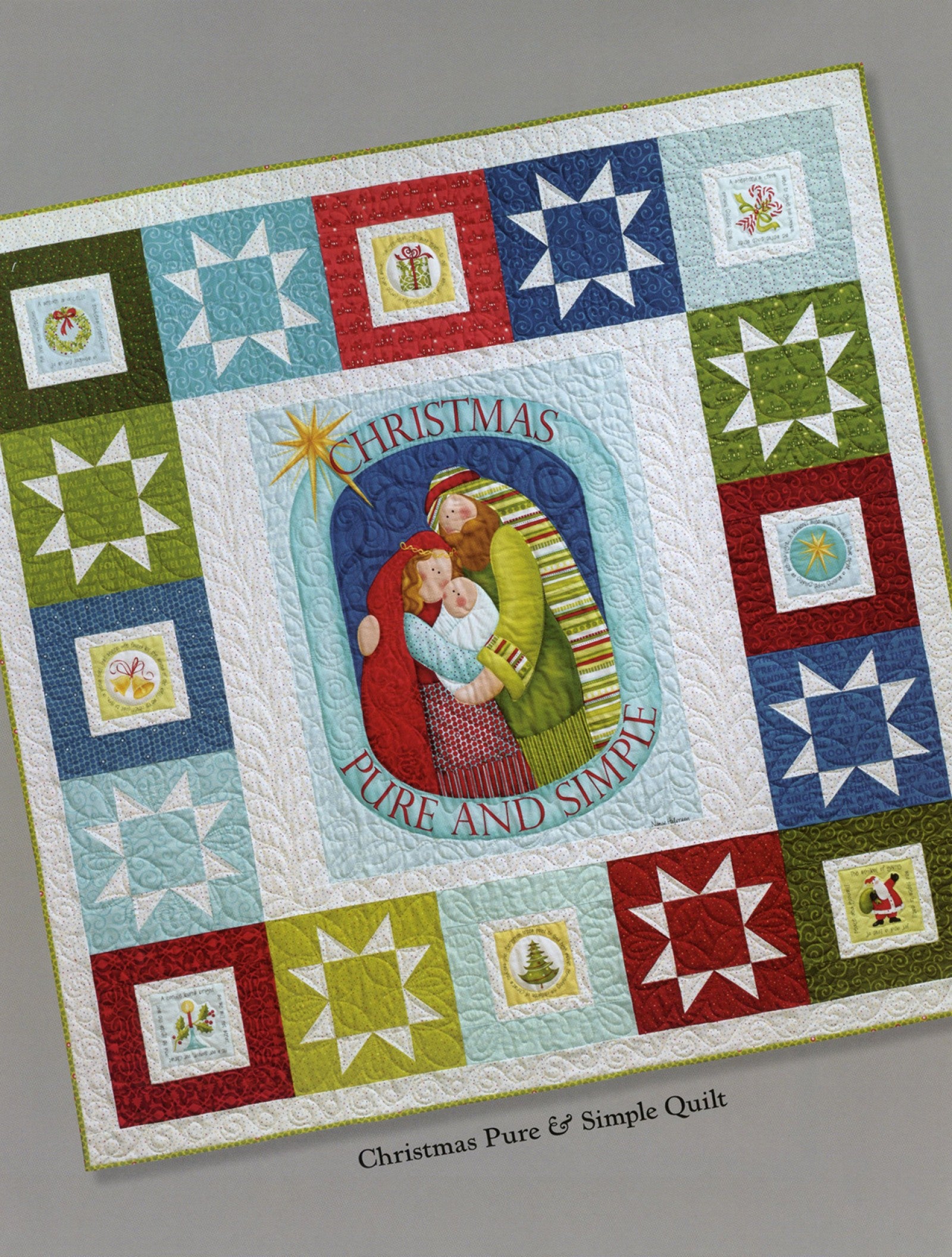 Interior page of the Christmas Pure And Simple quilt pattern book by Nancy Halvorsen of Art to Heart, showing the Christmas Pure and Simple Quilt with a central nativity and sampler border.