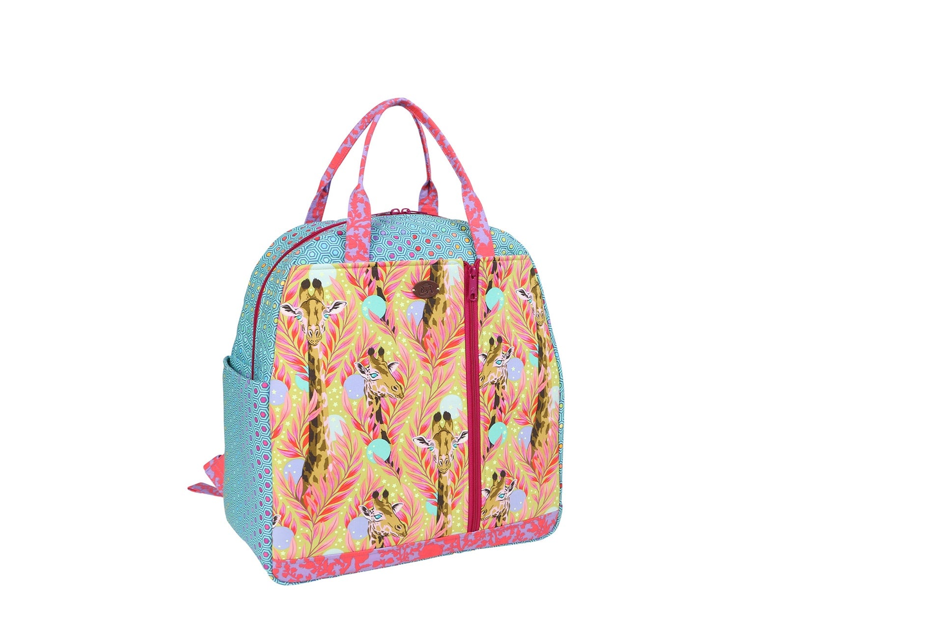 A finished Courtside bag in a colorful print shown from the front with grab handles and front zippered pockets.