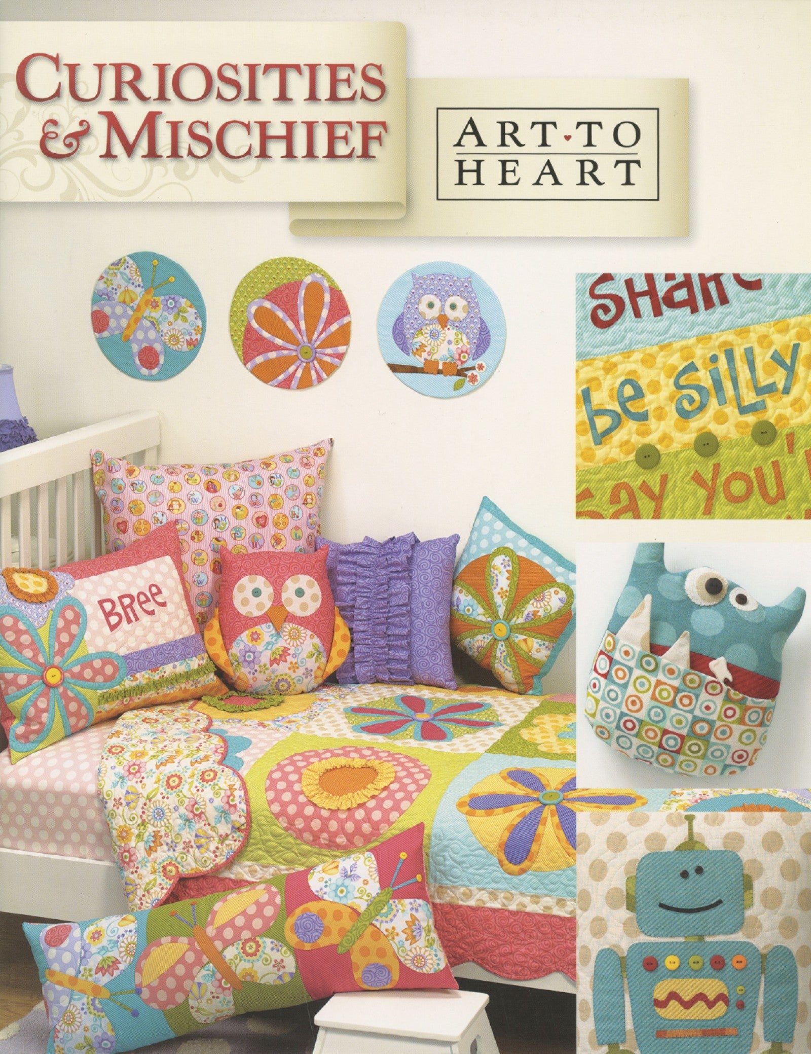 Front cover of the Curiosities and Mischief quilt pattern book by Nancy Halvorsen of Art to Heart, showing a bright children's room with appliqued owl pillows, a be silly growth chart, and a robot pillow.