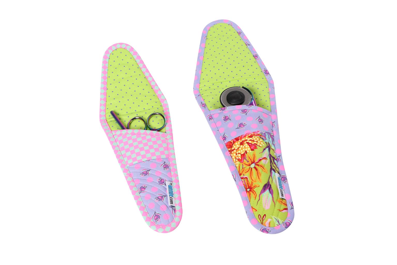 Two Cut It Out cases in floral prints, one open showing the magnetic-snap flap and the other closed.