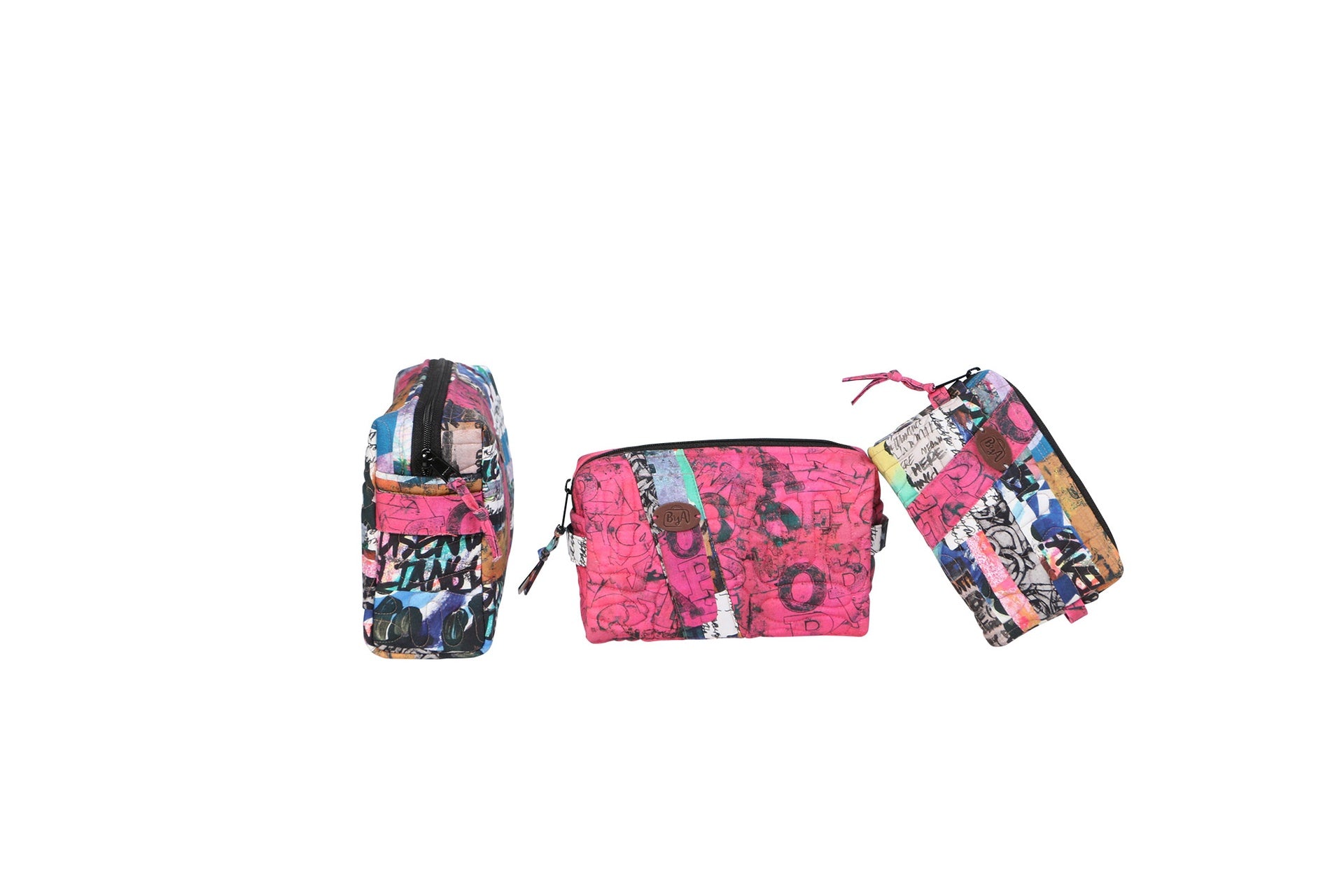 Three Ditty Bags sewn in pink and floral prints in small, medium, and large sizes with contrasting diagonal borders.