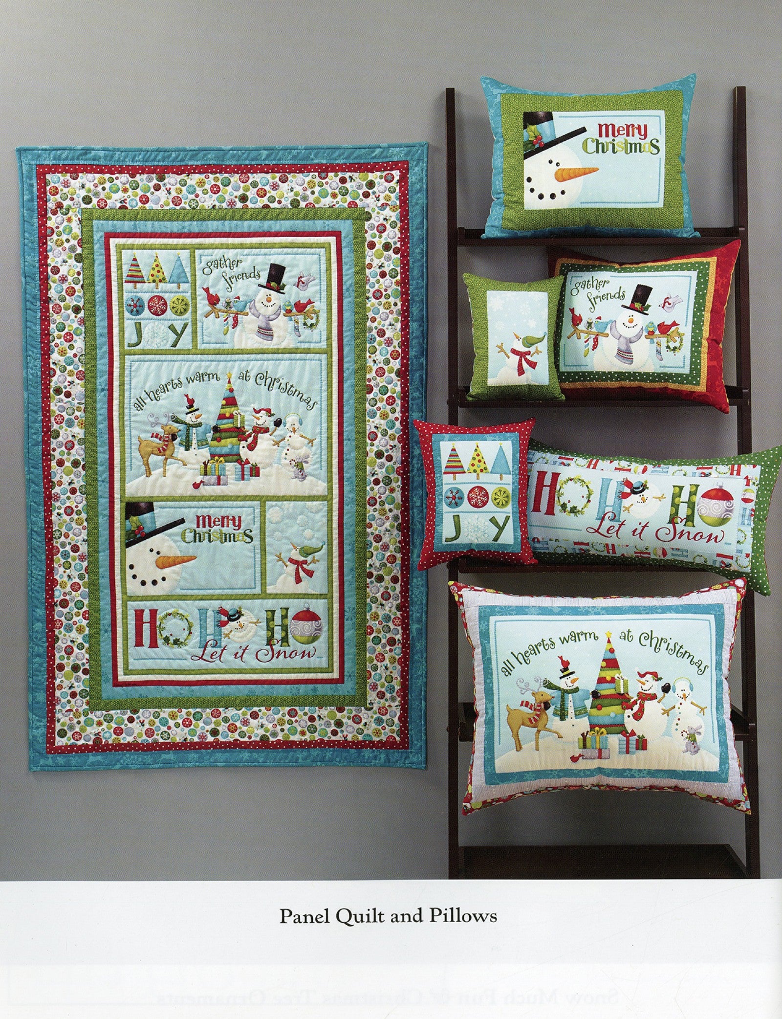 Interior page of the Ho Ho Ho Let It Snow quilt pattern book by Nancy Halvorsen of Art to Heart, showing the Panel Quilt and coordinating pillows in snowman and Christmas prints.
