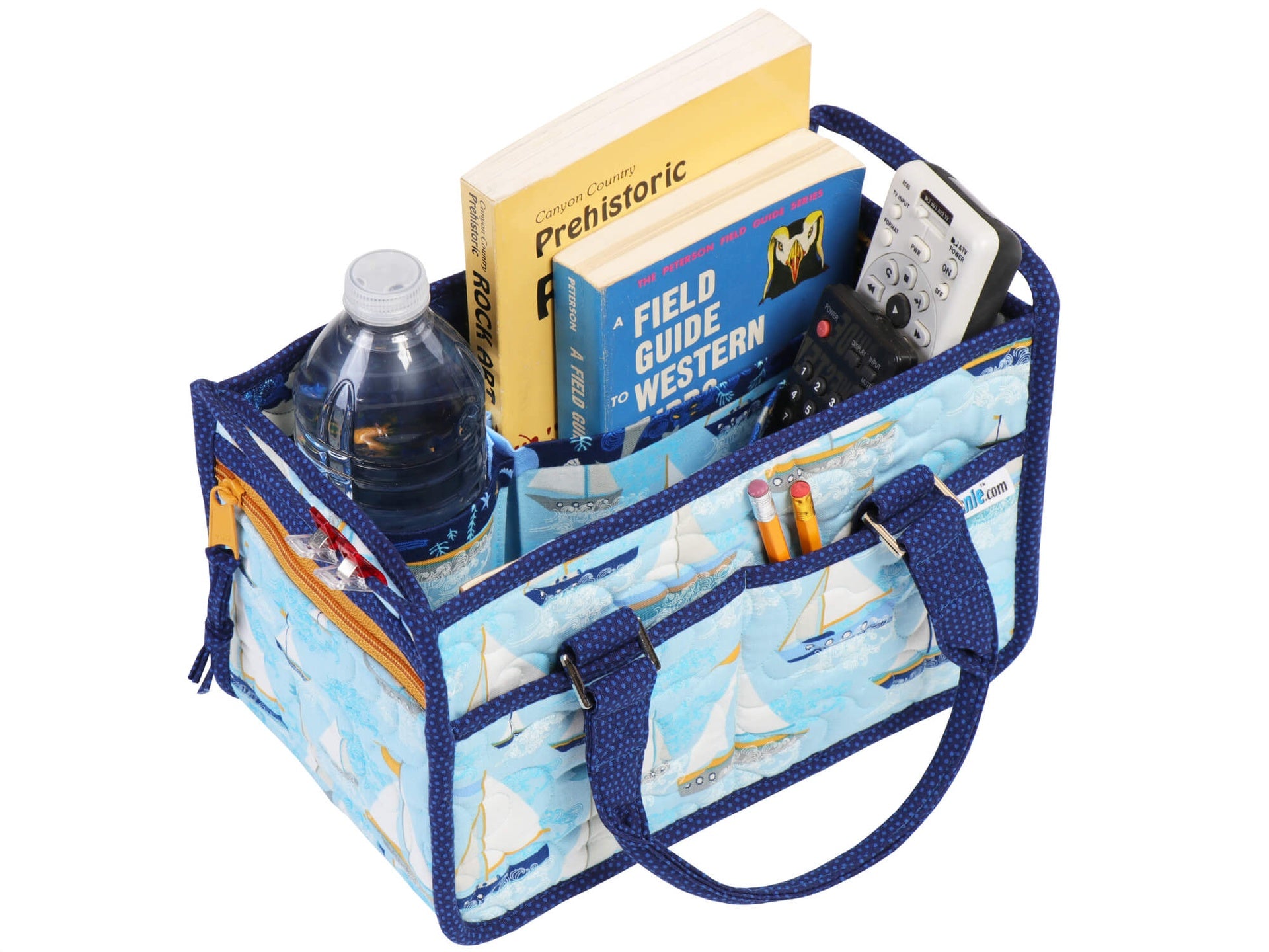 In Control Caddy in the blue sailboat print shown from the side, showing the open top, expanding interior dividers, the zippered end pocket, and the side slip pockets.
