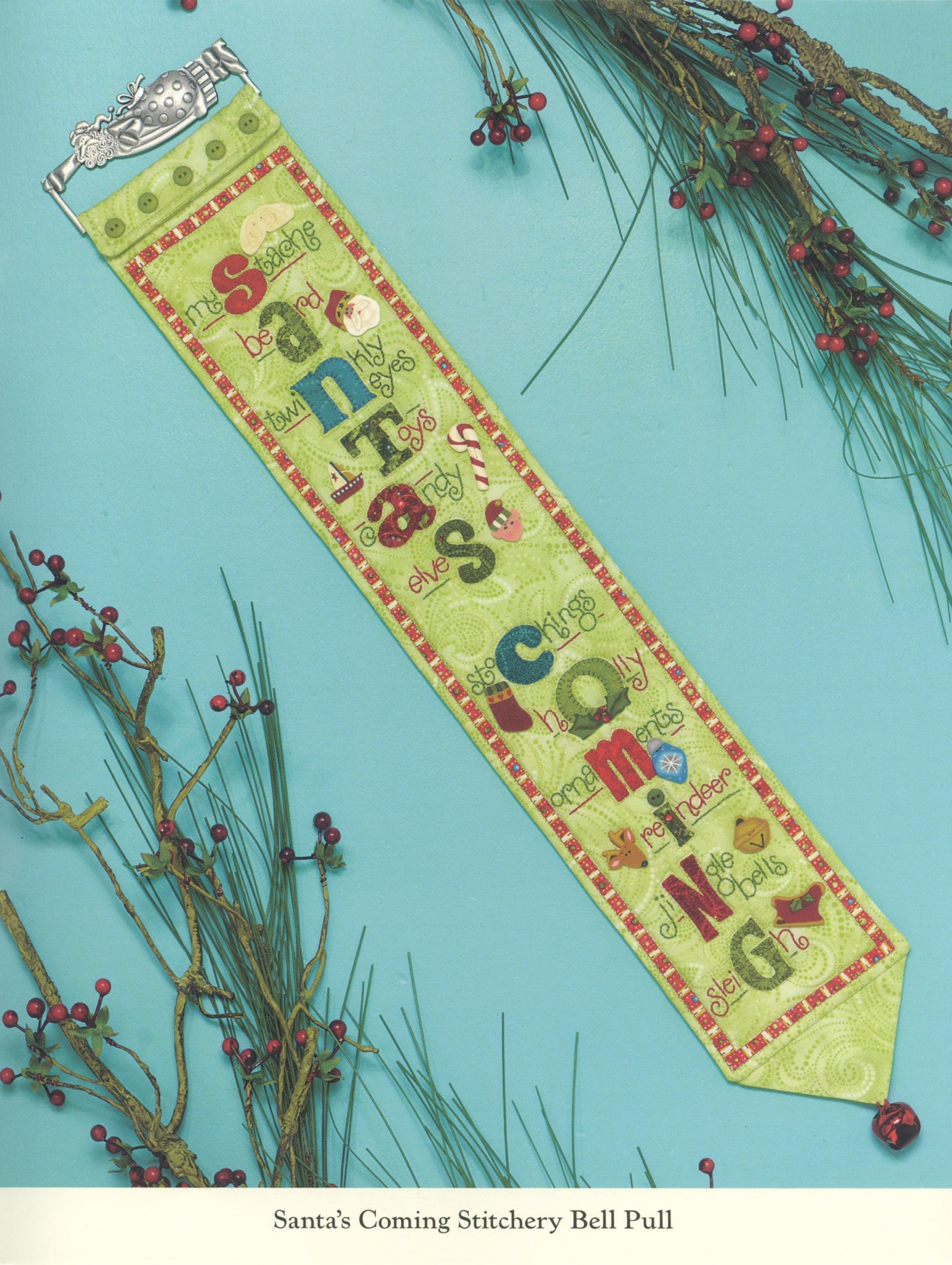 Interior page of the Jingle All The Way quilt pattern book by Nancy Halvorsen of Art to Heart, showing the Santa's Coming stitchery bell pull with hand-embroidered lettering.