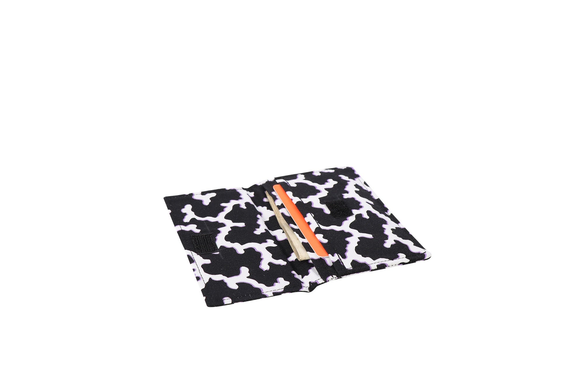 A black and white Sew Simple Wallet shown open flat with a card tucked into the pocket.
