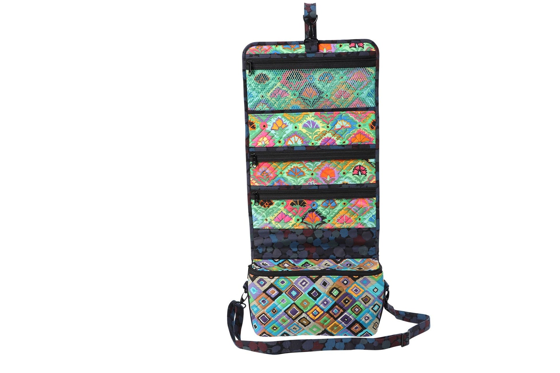A Travel Essentials organizer hung open with empty mesh and vinyl pockets, showing the zippered rows and hanging loop.