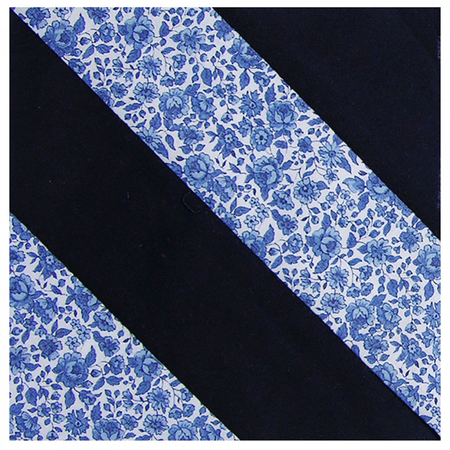 Diagonal stripes quilt block made with Creative Grids 90 Degree Double Strip Quilt Ruler