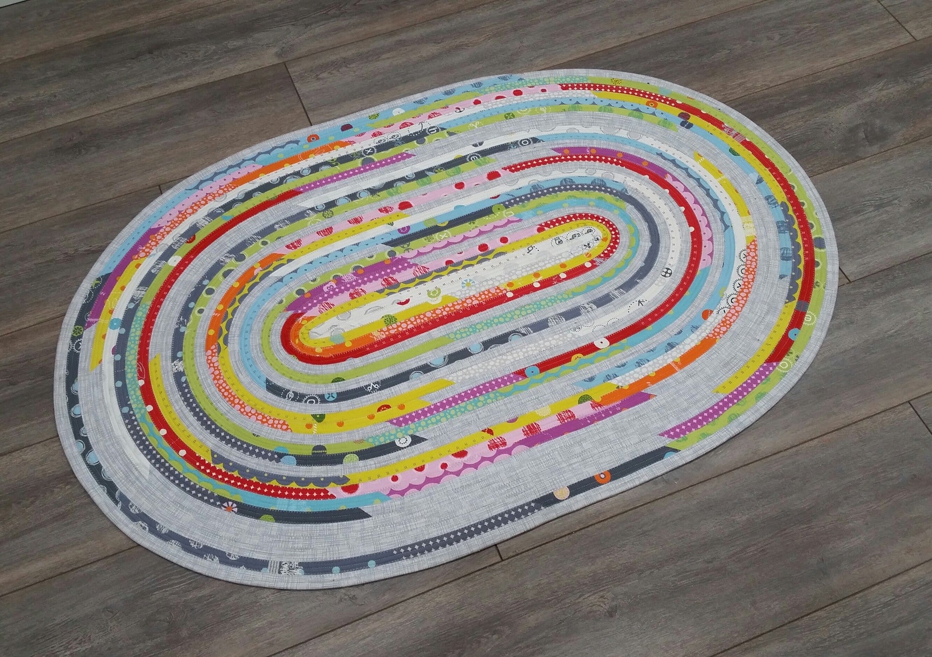 Jelly Roll Rug Oval 30-Inch x 44-Inch and More Sewing Pattern by Roma Lambson of RJ Designs