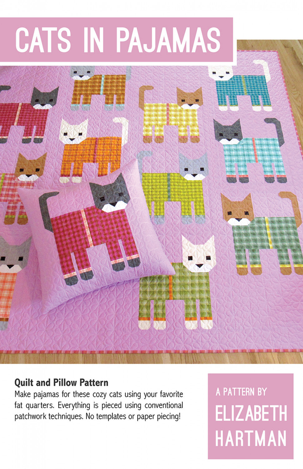 Cats in Pajamas quilt pattern cover by Elizabeth Hartman. Large 72 by 72 inch quilt displayed on a floor shows patchwork cats in gray, orange, white, and tan colorways wearing plaid and gingham pajamas in pink, teal, yellow-green, and olive on a lavender background. A coordinating pillow in the foreground shows a dark gray cat in pink plaid pajamas.