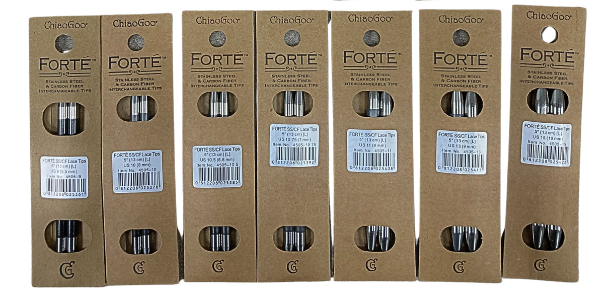 Seven packages of ChiaoGoo FORTÉ 5-inch stainless steel and carbon fiber interchangeable knitting needle tips with the Large [L] join, in a row on a gray background: US-9 (5.5 mm), US-10 (6 mm), US-10.5 (6.5 mm), US-10.75 (7 mm), US-11 (8 mm), US-13 (9 mm), and US-15 (10 mm). Each kraft paper card reads ChiaoGoo FORTÉ Stainless Steel & Carbon Fiber Interchangeable Tips, with two windows showing the pair of tips and a white label giving the size and item number.
