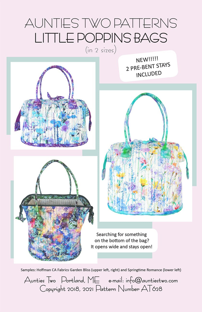 Aunties Two Patterns Little Poppins Bags sewing pattern (AT628) front cover, in 2 sizes, with a tag reading New, 2 pre-bent stays included. Three finished bags in white floral and blue watercolor prints with rolled handles; one photo looks down into an open bag beside the line It opens wide and stays open.
