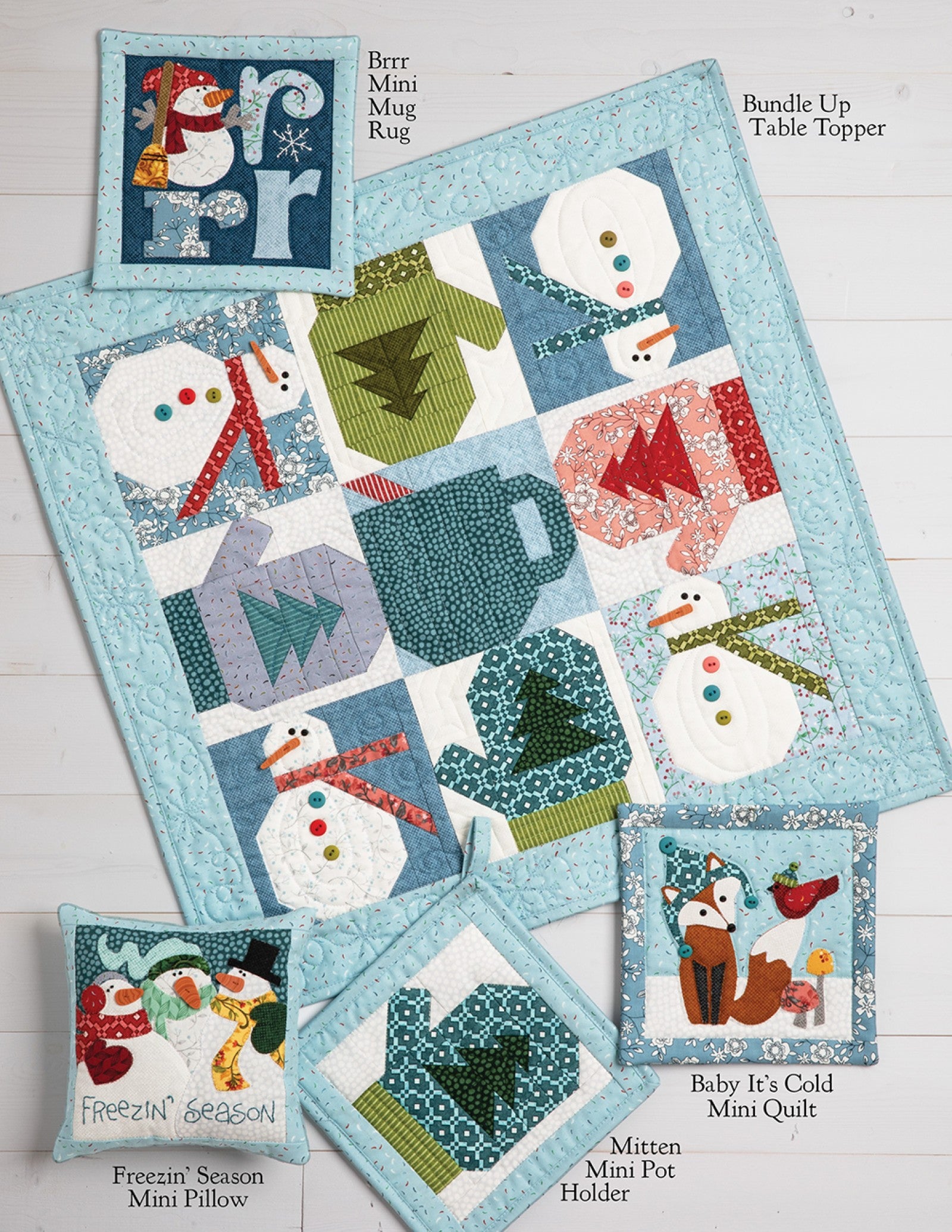 Interior page of the Frost Hill on Wander Lane pattern showing bonus projects such as a table topper, mini quilts, pot holder, pillows, and a mug rug.