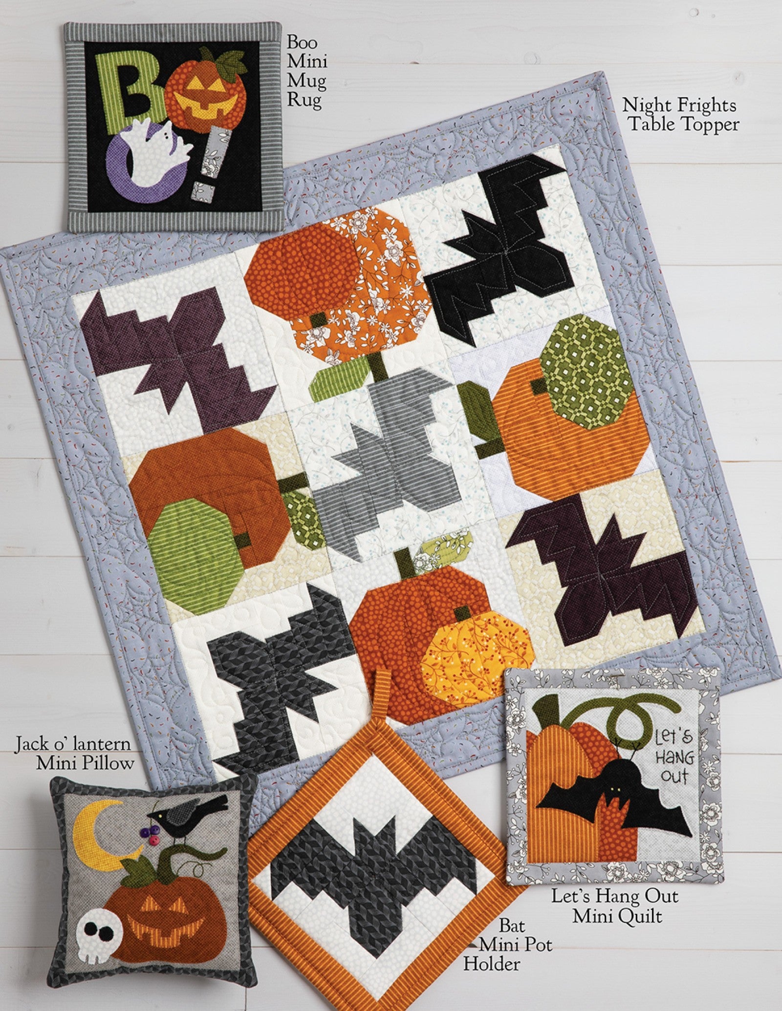 Interior page of the Midnight Manor on Wander Lane pattern showing bonus projects such as a table topper, mini quilts, pot holder, pillows, and a mug rug.