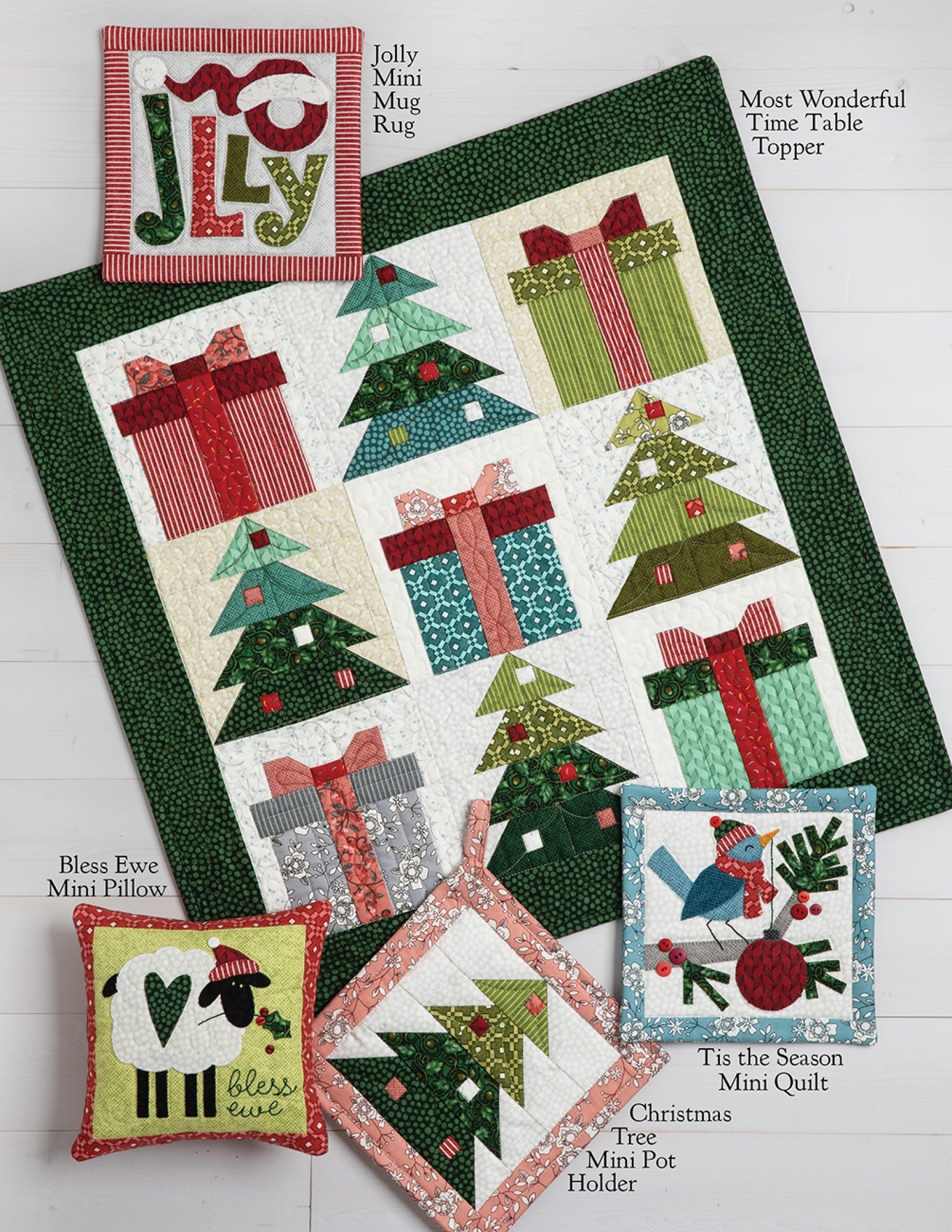 Interior page of the Mistletoe Crossing on Wander Lane pattern showing bonus projects such as a table topper, mini quilts, pot holder, pillows, and a mug rug.