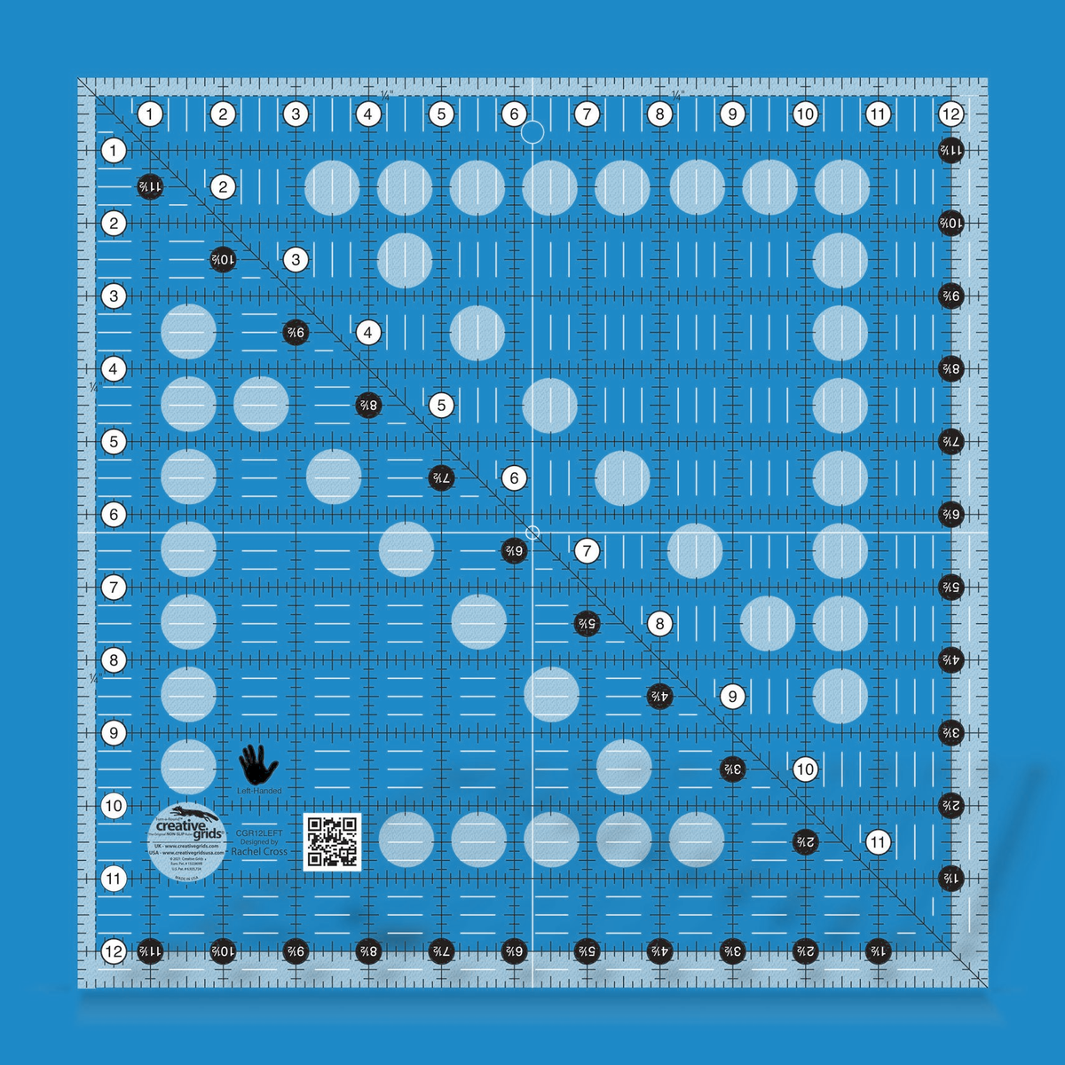 Creative Grids left handed 12-1/2 inch square quilt ruler CGR12LEFT by Rachel Cross rendered in translucent blue acrylic with black and white grid markings mirrored for left-handed cutting, whole-inch numbers in white dots on the top and left, half-inch Turn-a-Round numbers in black dots, a 45 degree diagonal, a 1/4 inch dashed seam line, white centering lines, and a left-hand icon.