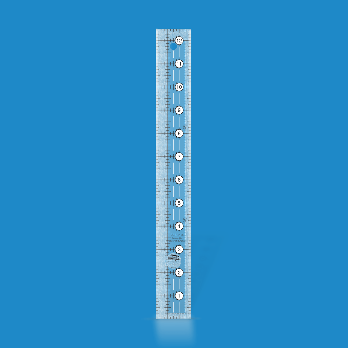 Creative Grids 1-1/2 x 12-1/2 inch rectangle quilt ruler CGR15125 by Rachel Cross rendered in translucent blue acrylic with black and white grid markings, whole-inch numbers in white dots along the length, and a 1/4 inch dashed seam line.
