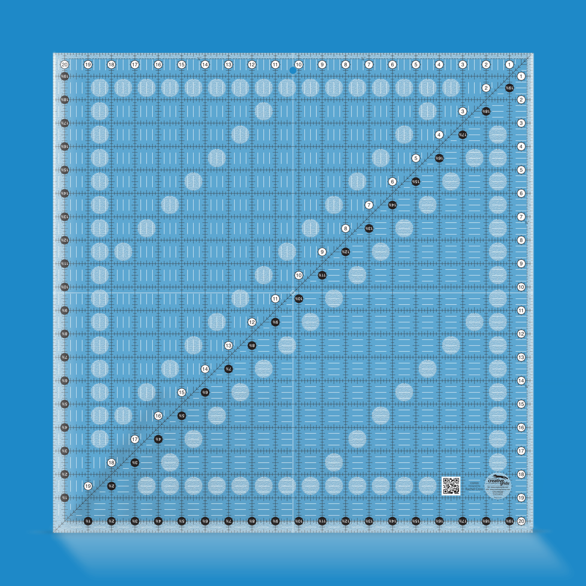 Creative Grids 20-1/2 inch square quilt ruler CGR20 by Rachel Cross rendered in translucent blue acrylic with black and white grid markings, whole-inch numbers in white dots, half-inch Turn-a-Round numbers in black dots, a 45 degree diagonal, a 1/4 inch dashed seam line, and white centering lines.