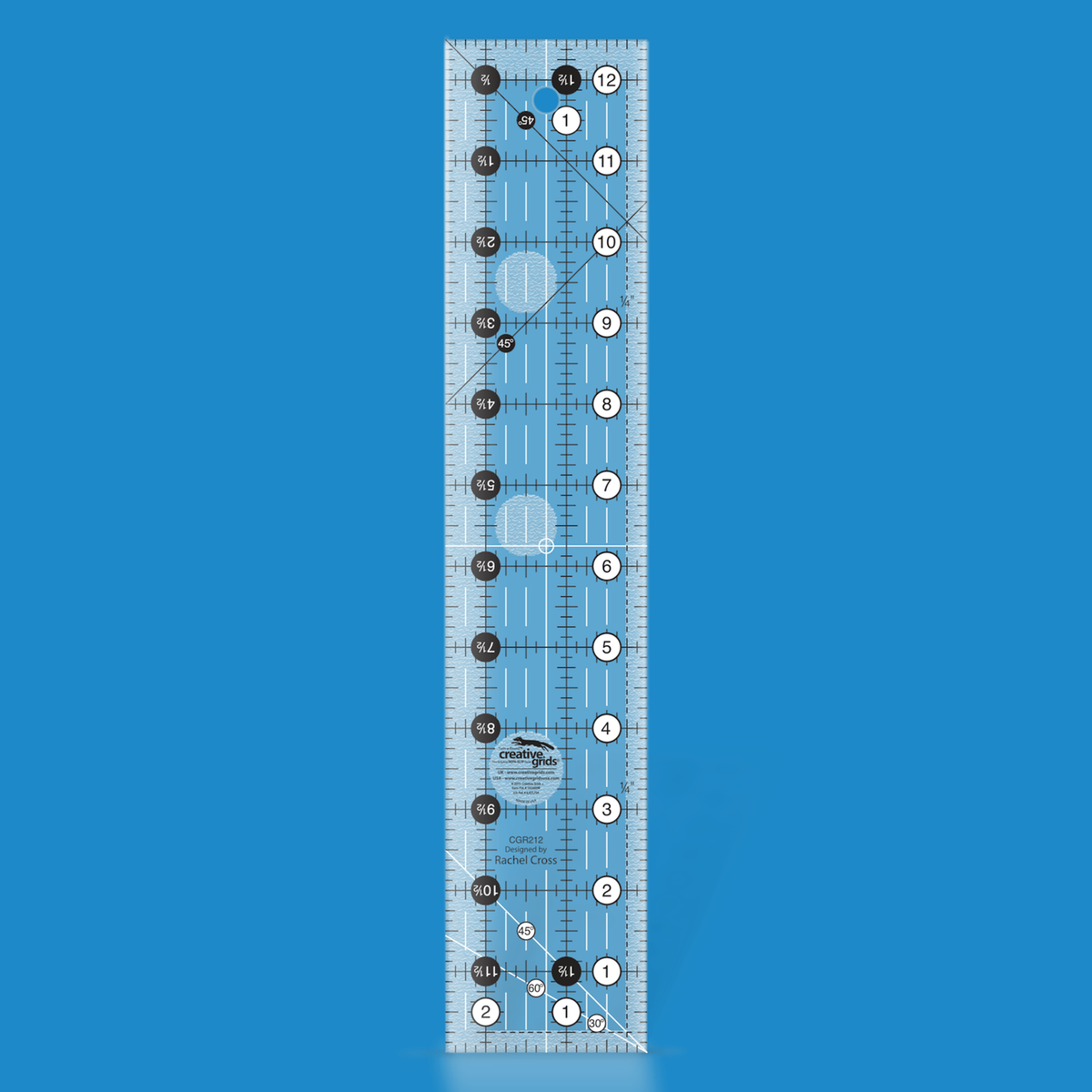 Creative Grids 2-1/2 x 12-1/2 inch rectangle quilt ruler CGR212 by Rachel Cross rendered in translucent blue acrylic with black and white grid markings, whole-inch numbers in white dots, half-inch Turn-a-Round numbers in black dots, crossed 45 degree lines, a 30/60 degree line, a 1/4 inch dashed seam line, and white centering lines.